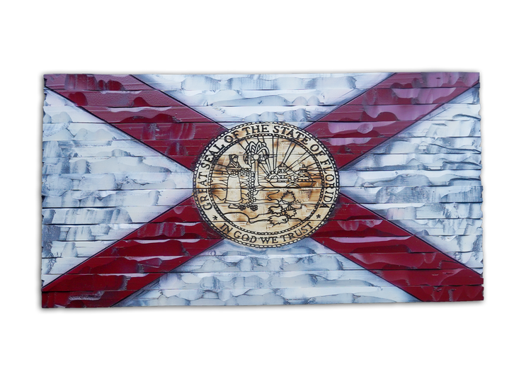 A rectangular wall art piece depicting the Florida state flag with a distressed, textured finish. The design features a white background with a red diagonal cross and the Florida state seal in the center, shown against a plain white background.